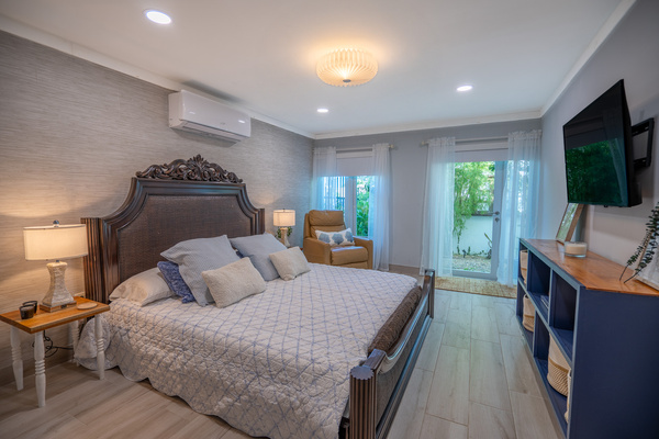 This is the view of the primary suites king bed overlooking the private garden in Dorado, Puerto Rico.