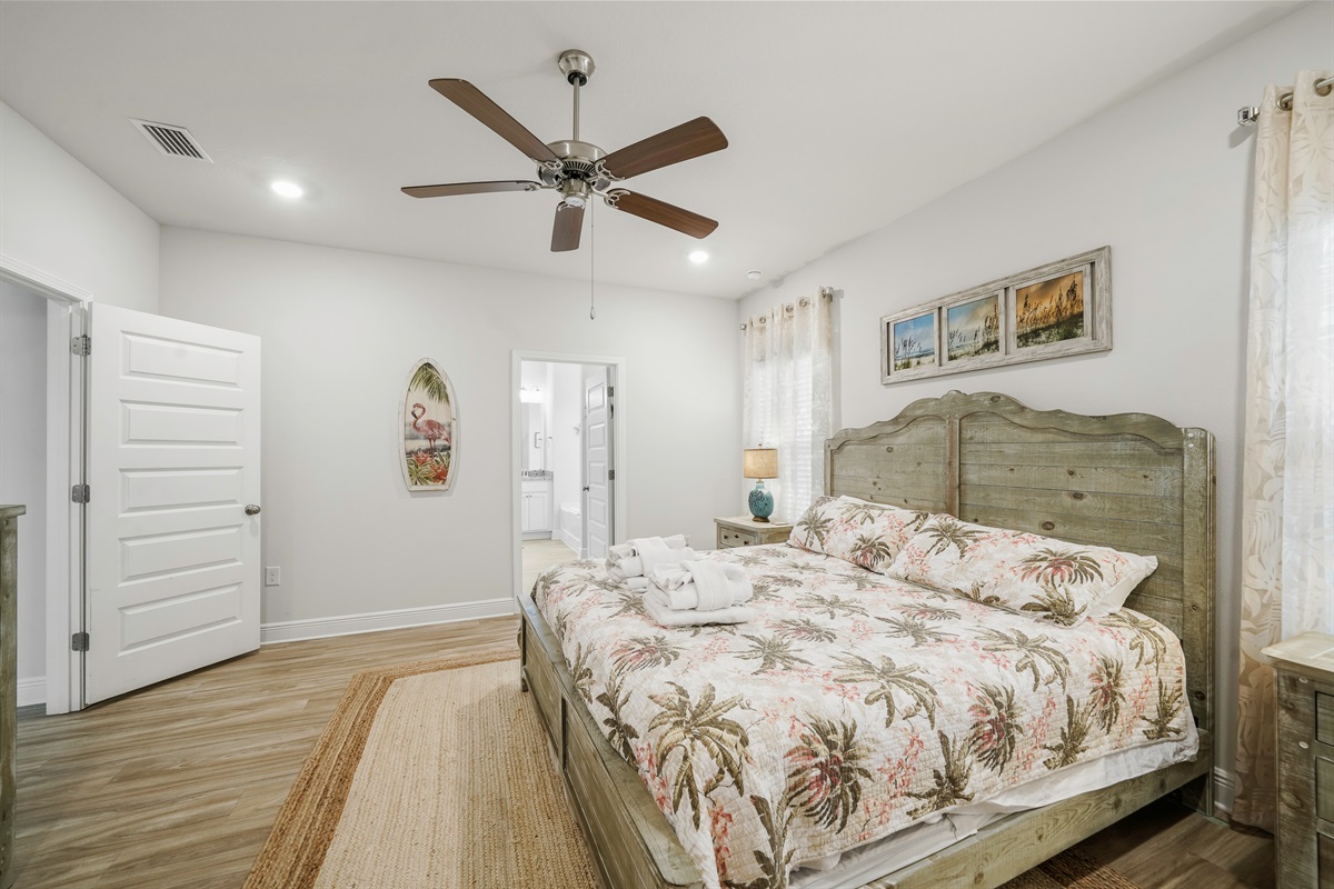 Bedroom 1: Primary Suite- Comfortable King Room with Ceiling Fan, Storage, Smart TV & En-Suite Bathroom
