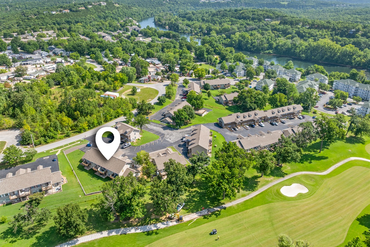 Another locator-style aerial showing the condo’s position near green space.