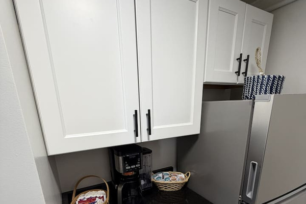 Coffee station and fridge.