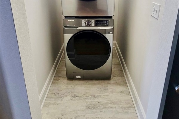 In-unit stackable washer dryer combo provided.