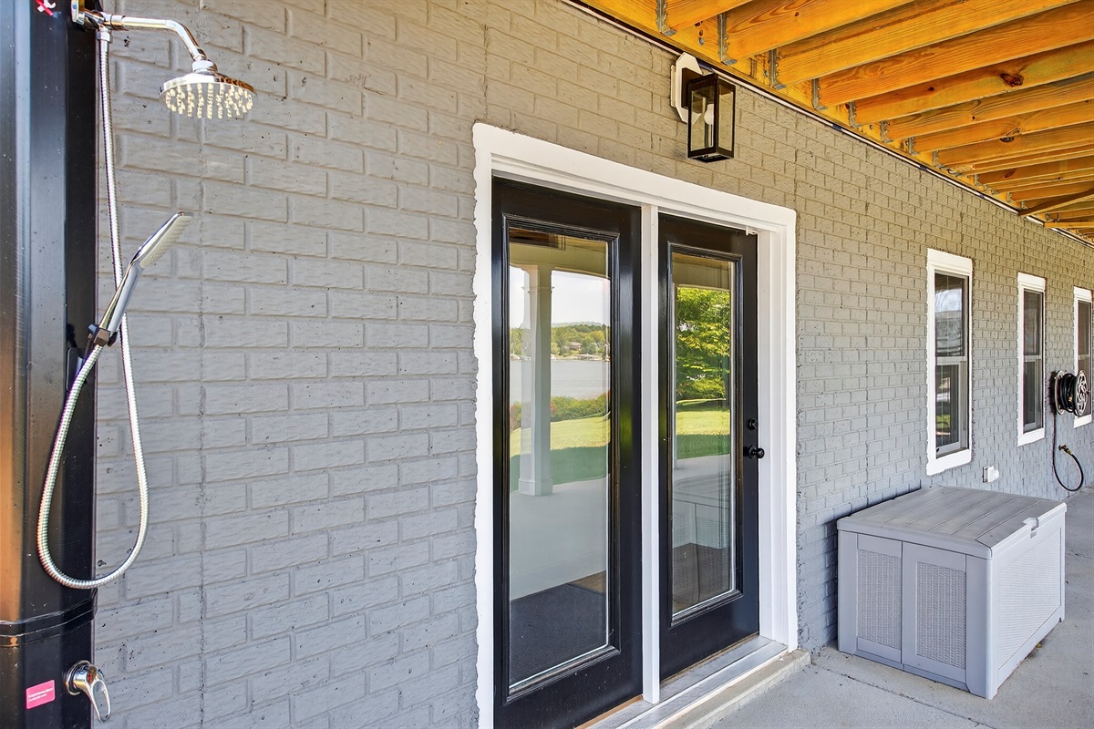 Rinse off sandy toes and sun‑kissed skin in the private outdoor shower before heading inside.
