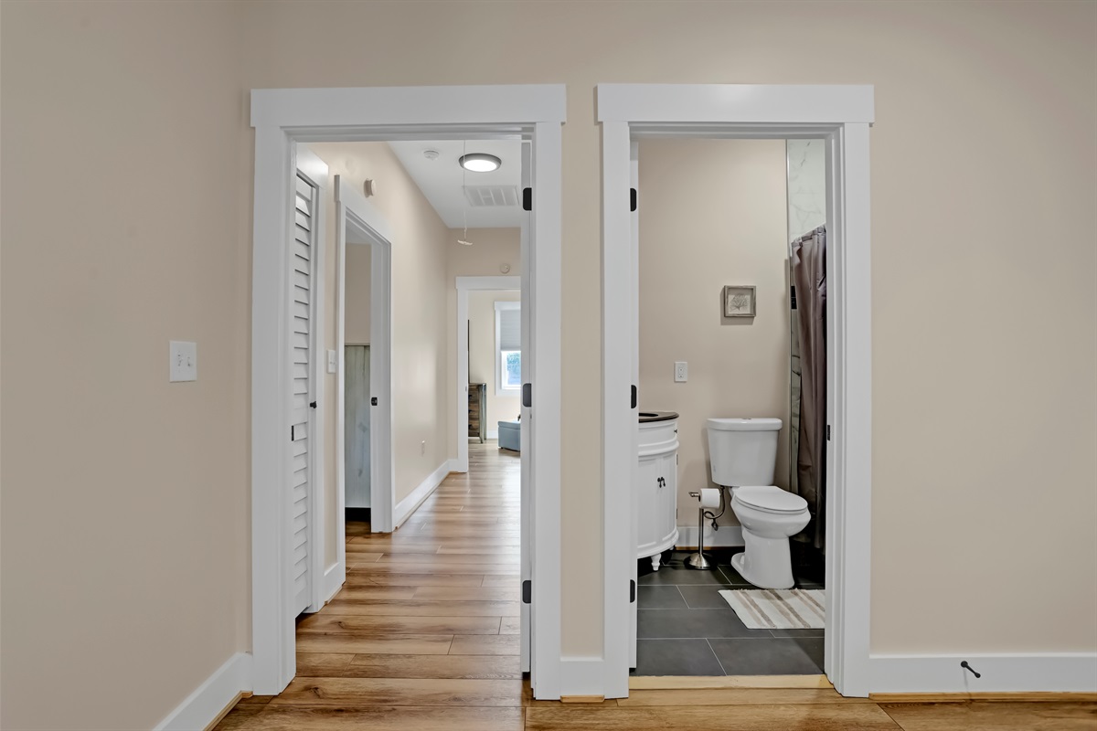 Full bath located off the living room for access with ease.