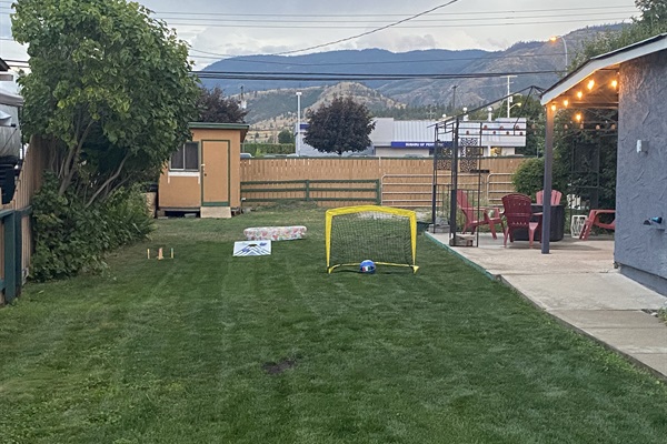 The fully fenced back yard is great for the kids to kick around a ball or play some games while your relax and watch on the patio.