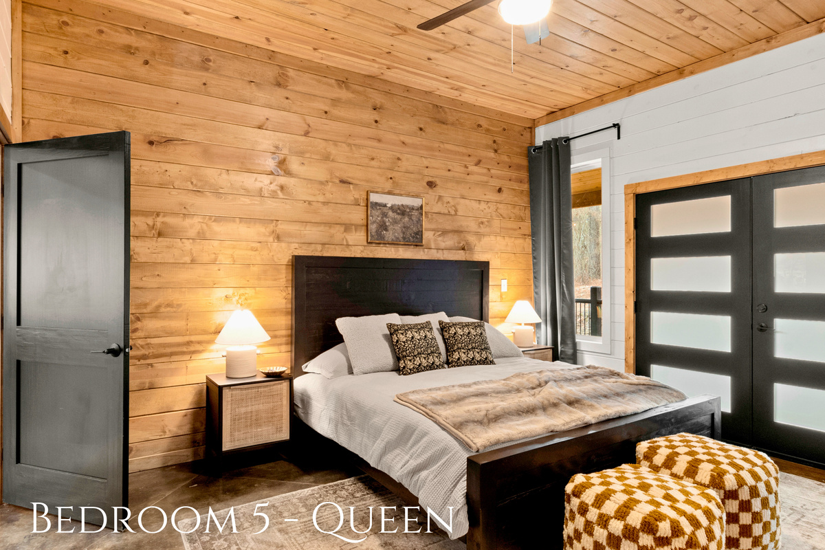 Drift off to dreamland in this Queen size bed, where rustic charm meets serene comfort, and French doors open to starlit nights.