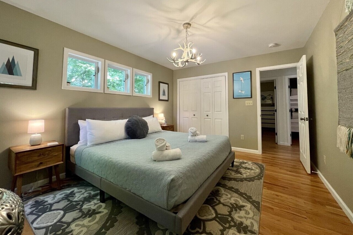 Master Bedroom at the end of hall. You can see the doors to other bedrooms