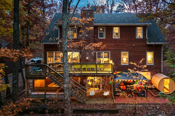 Your three-story mountain retreat, glowing with warmth and ready for unforgettable family time