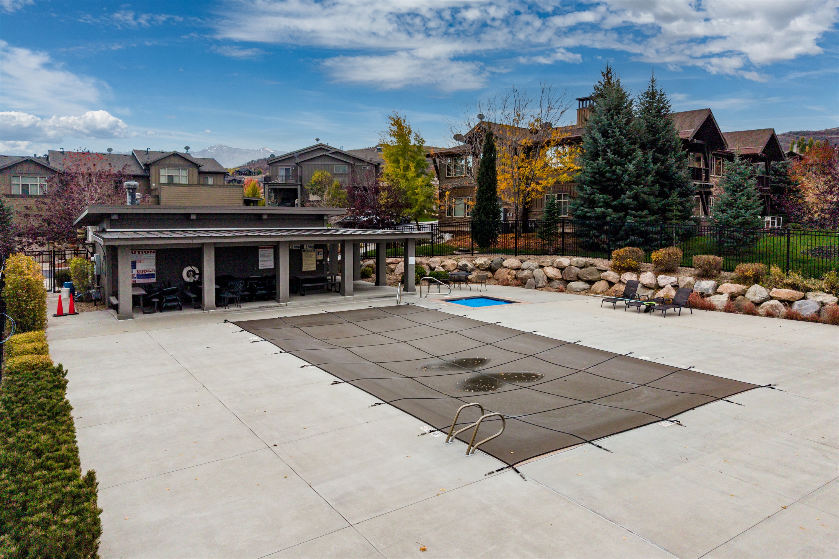 Seasonal community pool and year-round hot tub with mountain views at Edgewater Huntsville.