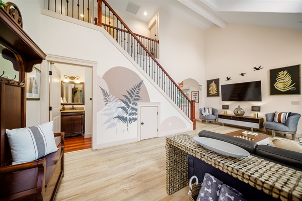 The delicately hand painted mural illustrates the love and detail that went into the design of this modern waterfront retreat. Equally perfect for relaxation and  entertaining, vaulted ceilings and natural light complete your lovely beach getaway.