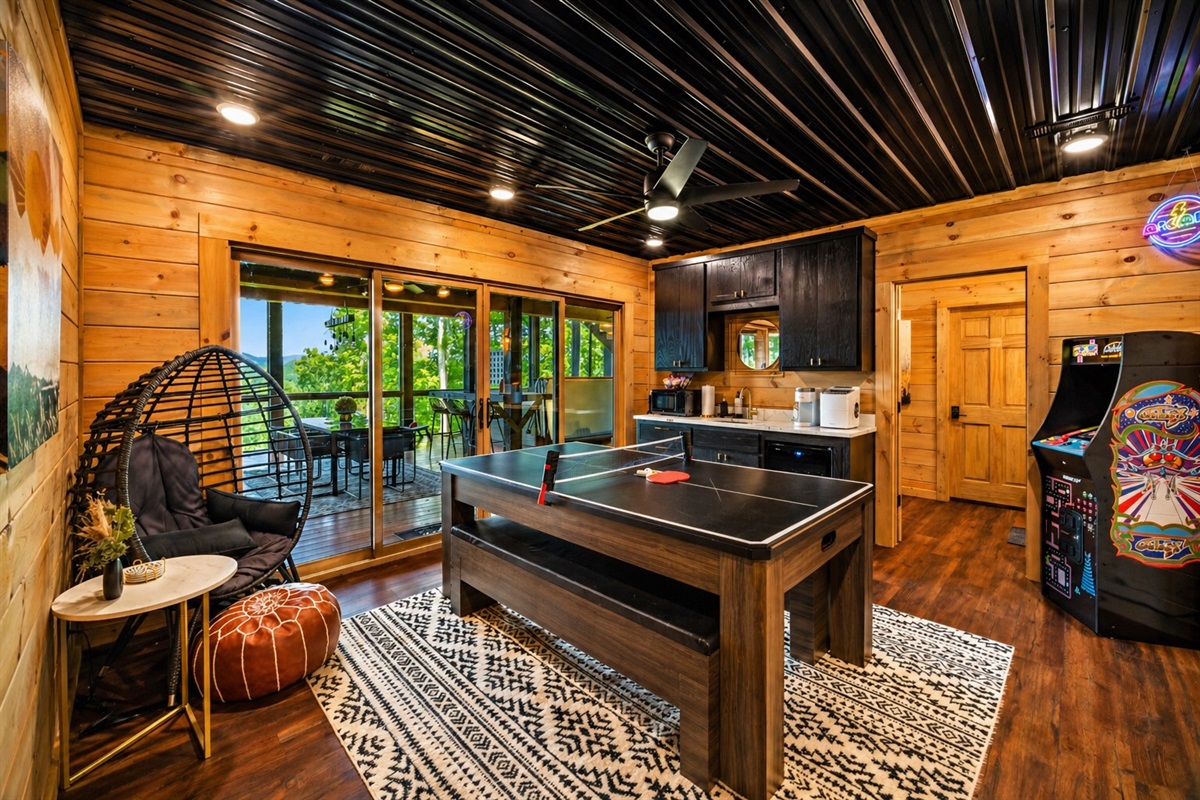 The ultimate hangout spot with a convertible ping pong & air hockey table, arcade game and board games all to keep the energy going.