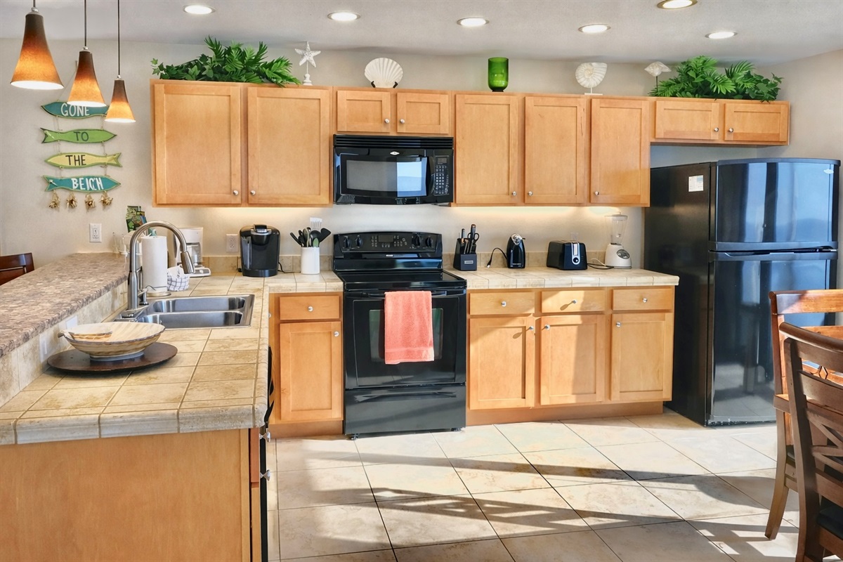 Fully stocked kitchen with bar seating