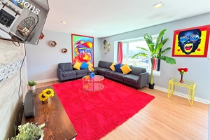 Retreat to the comfort of our living area, enhanced with the cinematic allure of Roku TV for a blissful escape.