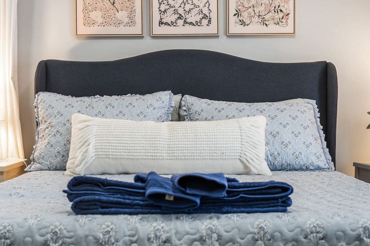 Freshly made and ready for you, with towels laid out for added comfort.