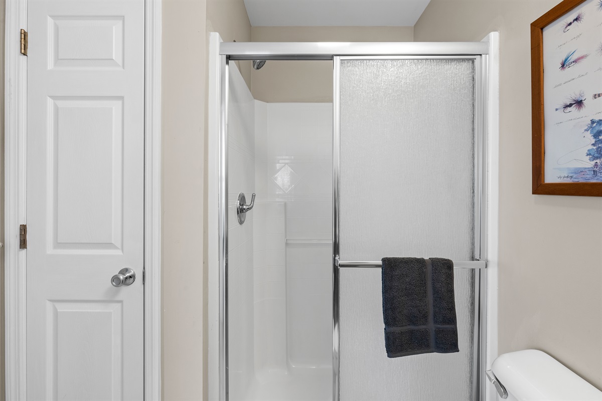 Clean shower space with fresh towels ready for your stay