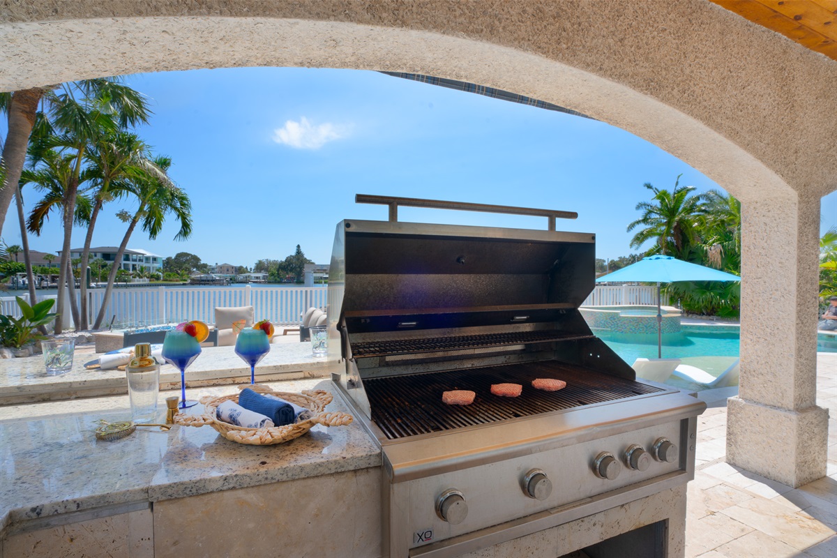and a covered outdoor kitchen.