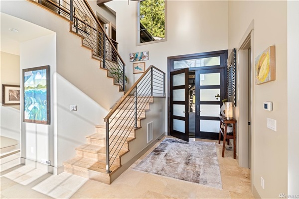 Welcoming front entry with elegant stairs to the second floor.