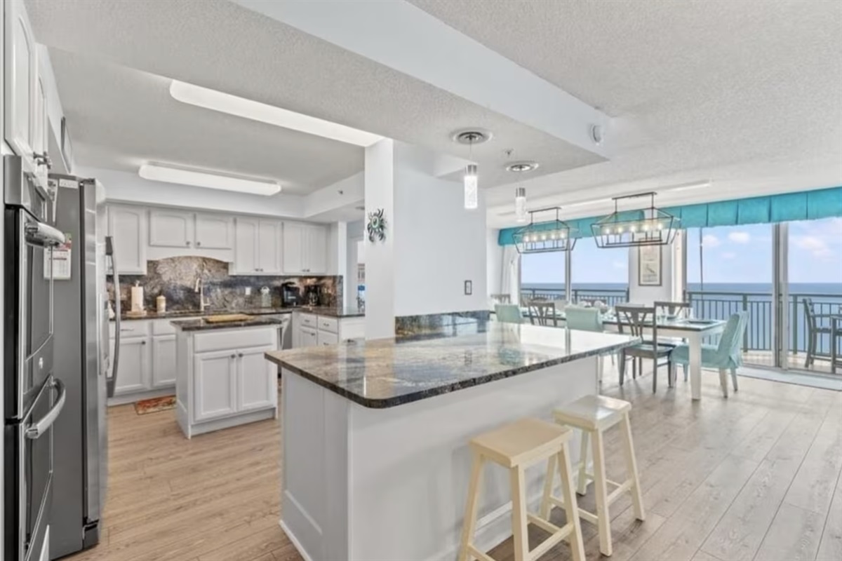 The kitchen also has a large breakfast bar for dining or for serving up great family meals