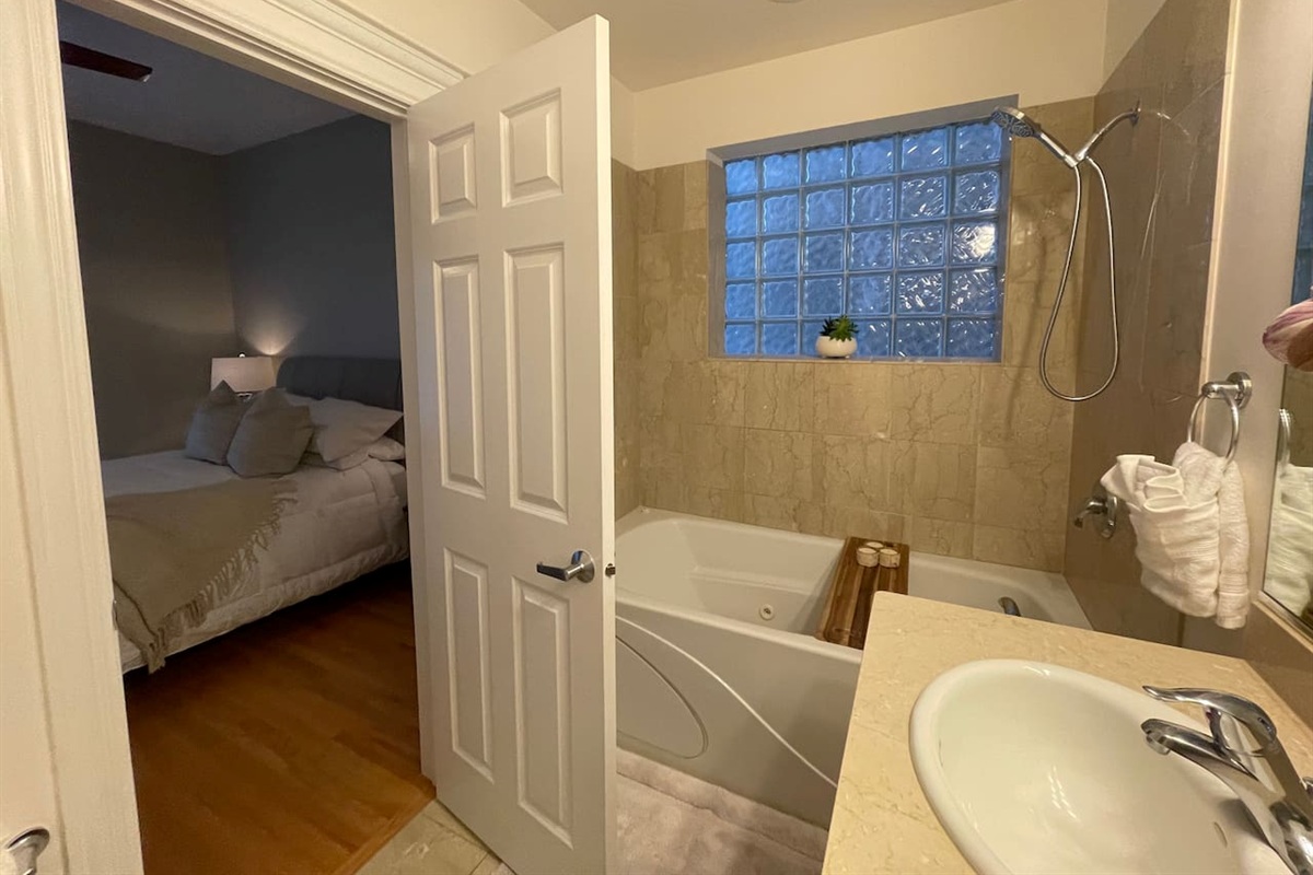 Clean in-suite bathroom with a jet tub