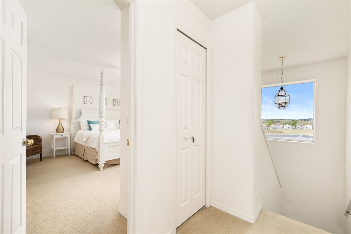 Just at the top of the stairs is the king master suite.