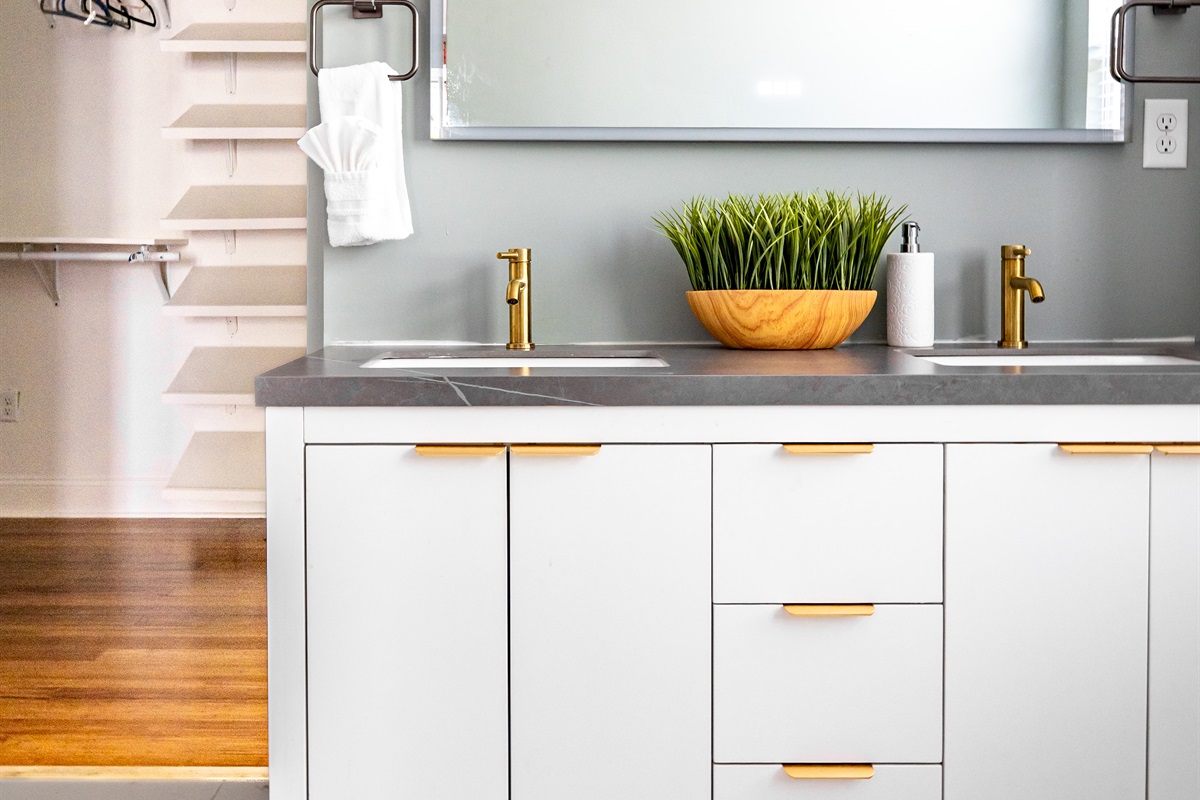 Luxury en-suite bathroom with 2-person air massaging bath, tiled rain shower, double vanity, walk-in closet