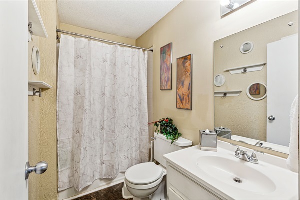 The upstairs bathroom offers a full tub/shower.