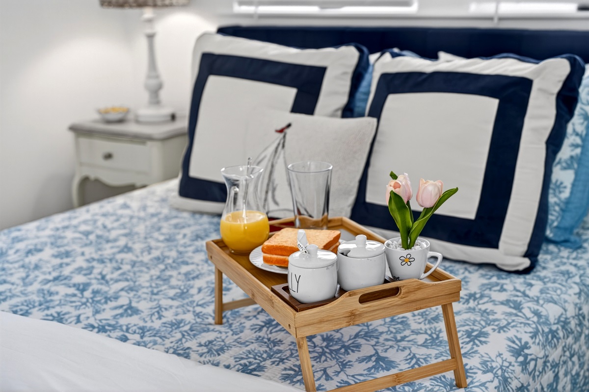 Bright queen bedroom with easy bathroom access and direct entry to the second-floor deck.