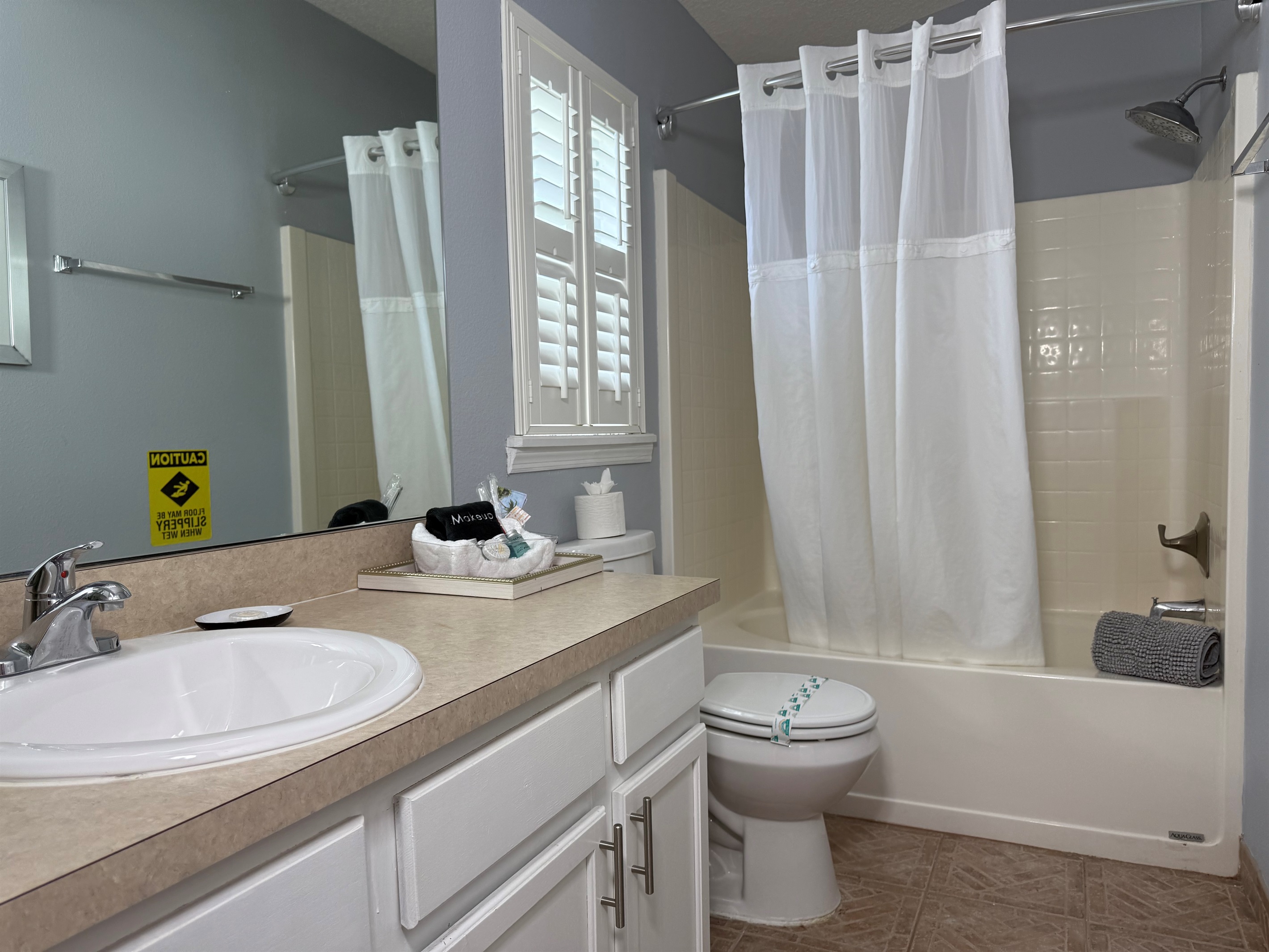 En Suite Master Bathroom with Tub and Amenities 