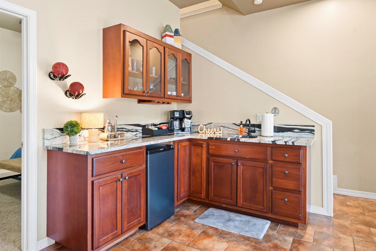 A convenient downstairs bar adds flexibility, especially for snacks, drinks, and late-night cravings.