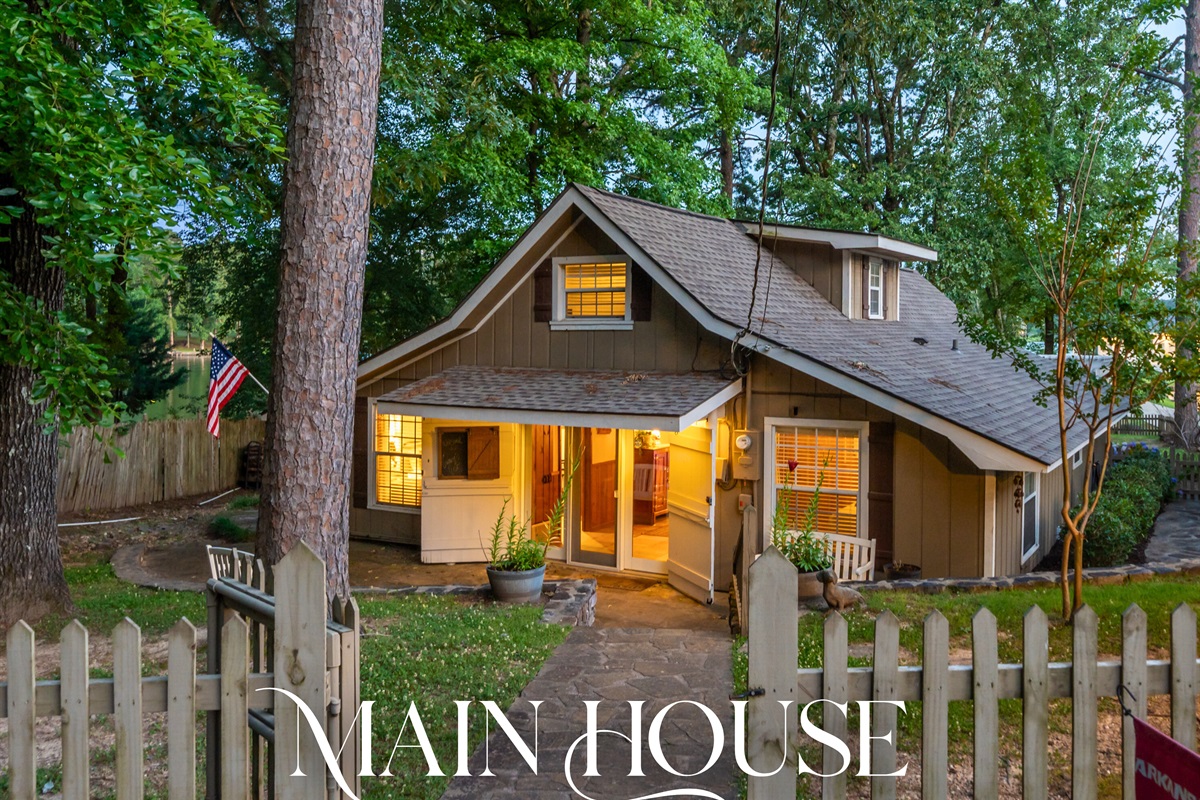 The main house welcomes you with open arms, warm lighting, and rustic style. It’s the cozy heart of the whole lakeside experience.