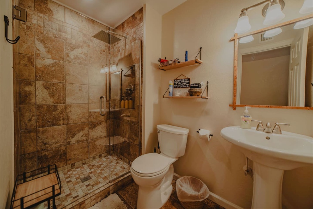 Clean, modern bathroom with quality finishes and walk-in shower