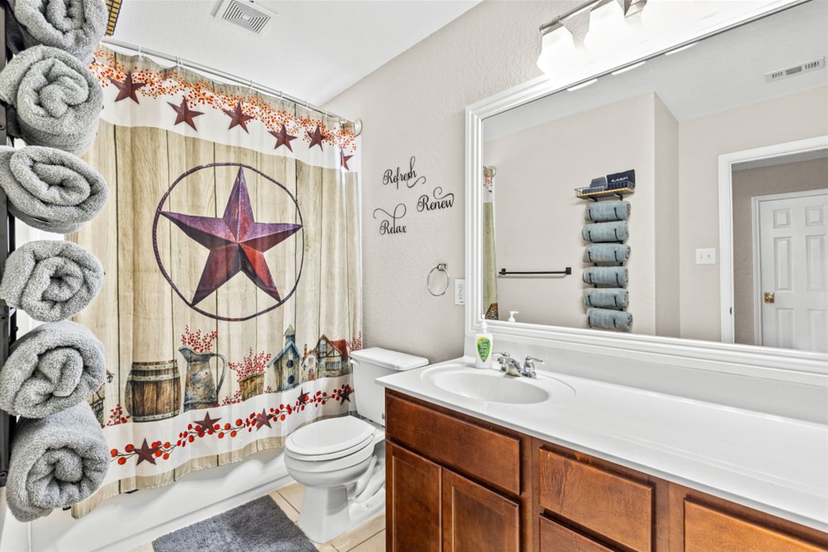 Full bathroom, shower tub combo, stocked with premium products, towels, and everything needed for comfort and convenience.