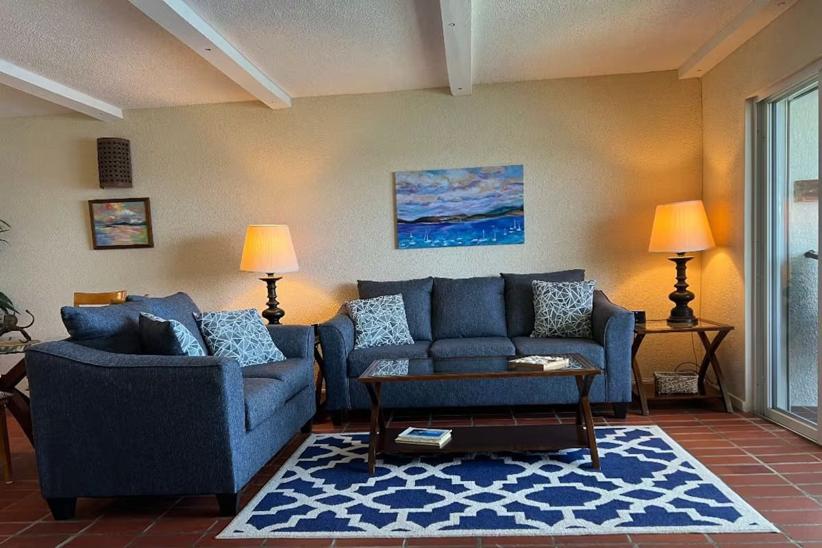 Spacious living area with comfortable seating and stunning oceanfront views.