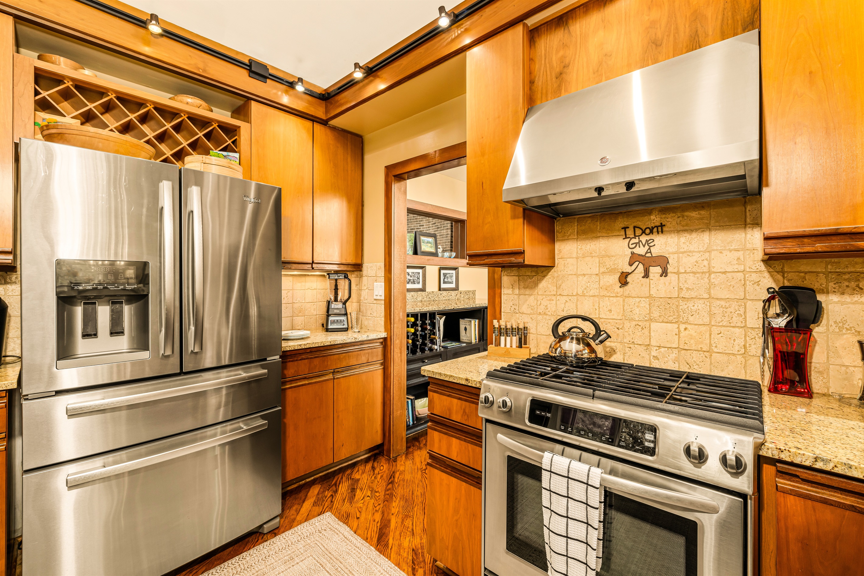 Well-equipped, the main floor kitchen has full-sized refrigerator freezer with ice maker/chilled water, a breakfast station with toaster, coffee station with Keurig and Cuisinart and all the supplies you'll need.