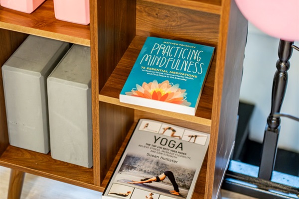Take a quiet moment with our small reading nook featuring wellness and mindfulness books for a peaceful cabin reset.