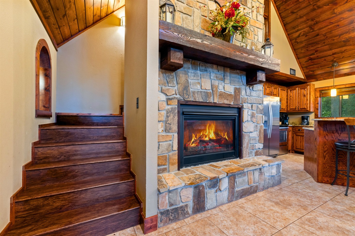Warm stone fireplace for those perfect cabin nights.