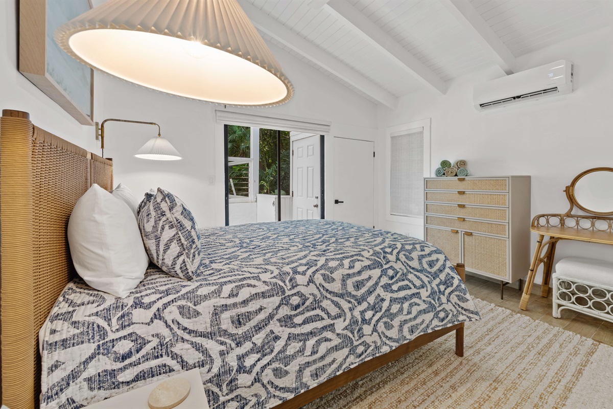 Access to the balcony and ac unit to keep the room comfortable for you. This bedroom also comes with a make up station that could double as a desk!