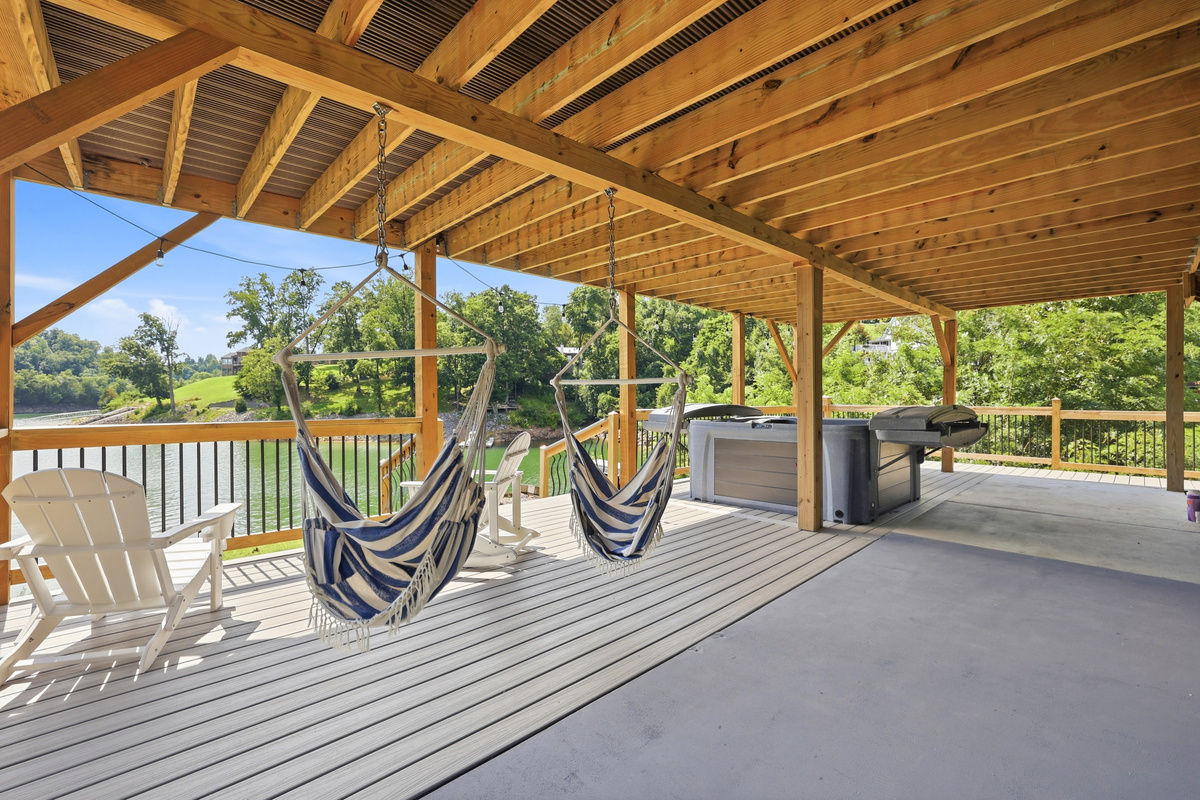 Downstairs Patio area with grill and hot tub to include outdoor seating