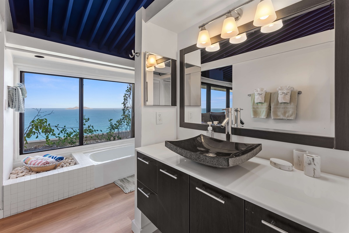 Unwind with island luxury in this bright, spacious bathroom retreat.