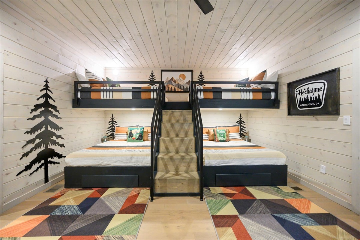 Bunk room features Queen beds on bottom and full size beds on top and custom iron railings for safety.