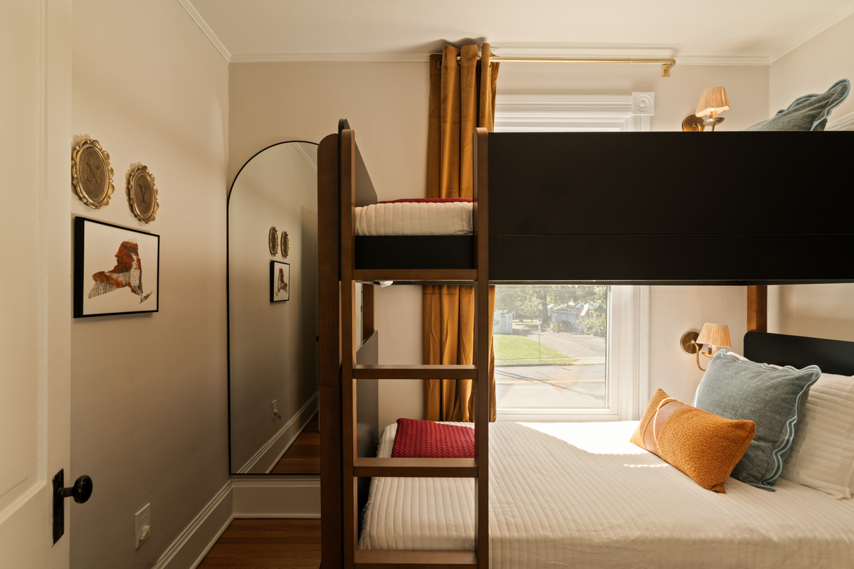 A cozy little bunk room with plenty of personality. One bunk bed provides two twin sleeping spaces, perfect for kids or friends traveling together.
