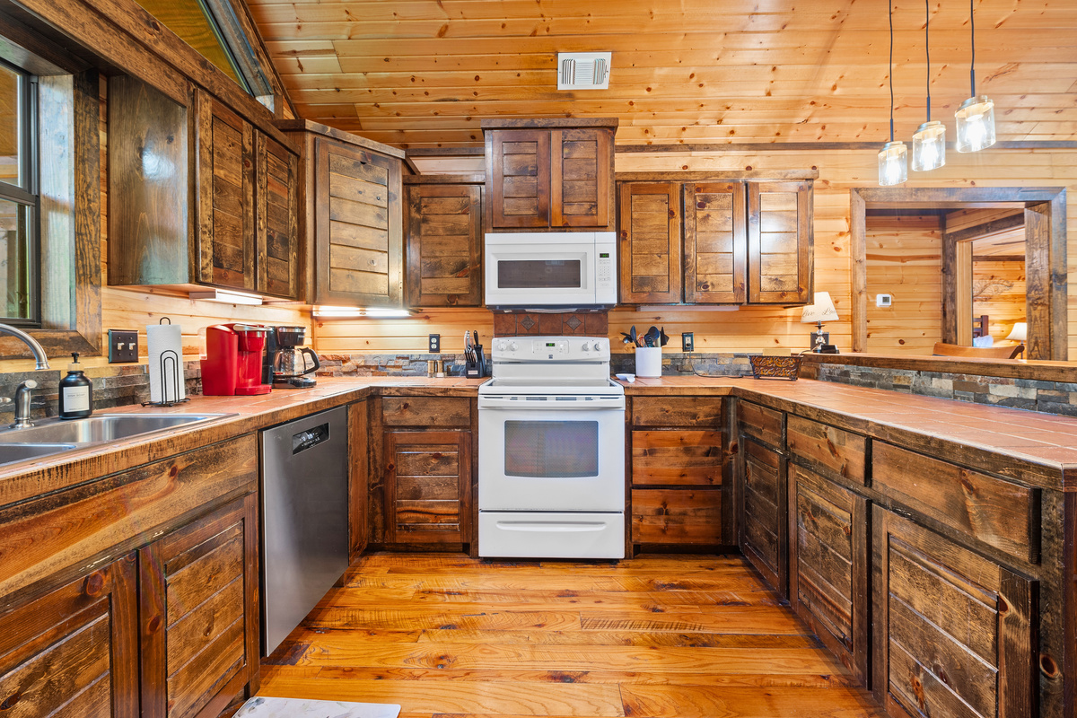 Cooking feels like a treat in this rustic kitchen, packed with all the essentials and a whole lot of cabin charm.