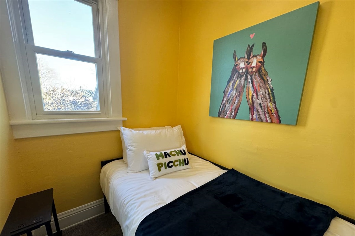 Twin bed in the alcove of the Machu Picchu Room.