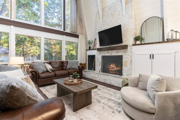 Enjoy the wood-burning fireplace or cozy up for a movie on the big screen TV.