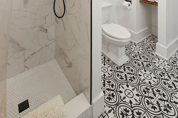 Spacious full bath with double vanity and tile shower. 