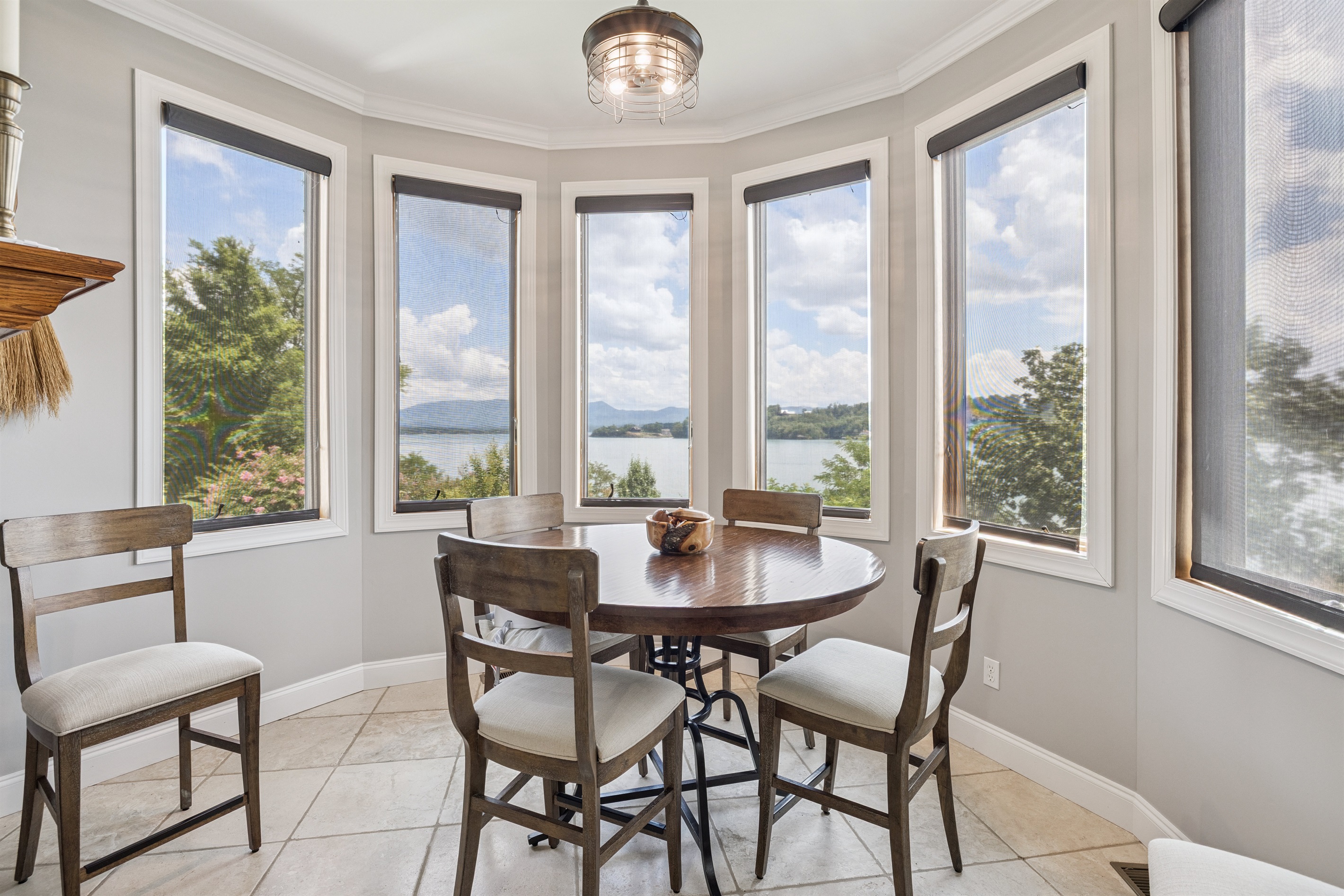 Breakfast Table seats up to 6 with Panoramic view of the lake (2nd dining table seats 12 in living room)