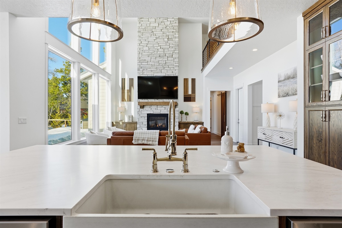 Stunning Modern Kitchen Overlooking Grand Stone Fireplace
