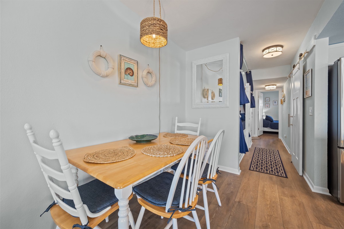Simple, inviting dining space with coastal touches and room for everyone