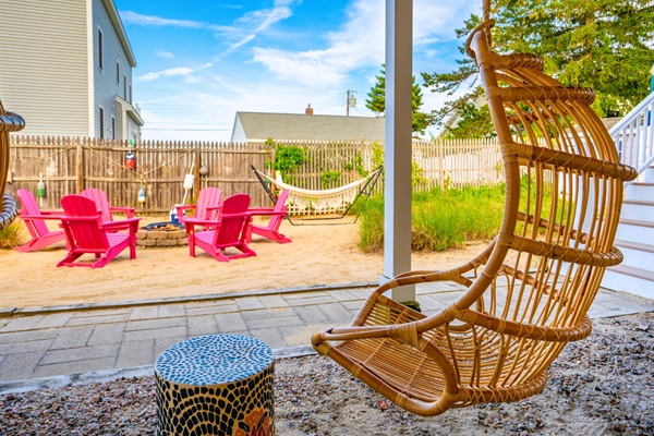 Take a seat on the swing and let the firepit’s glow set the perfect mood.