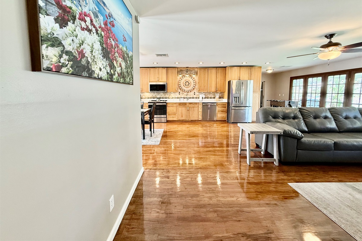 The perfect blend of function and flair, this living room features polished hardwood floors, neutral tones, and an effortlessly chic design.