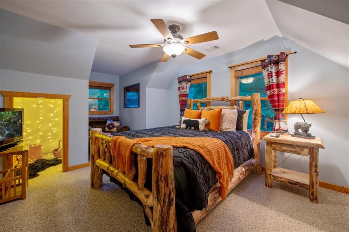 The upstairs bedroom features a TV for your enjoyment.